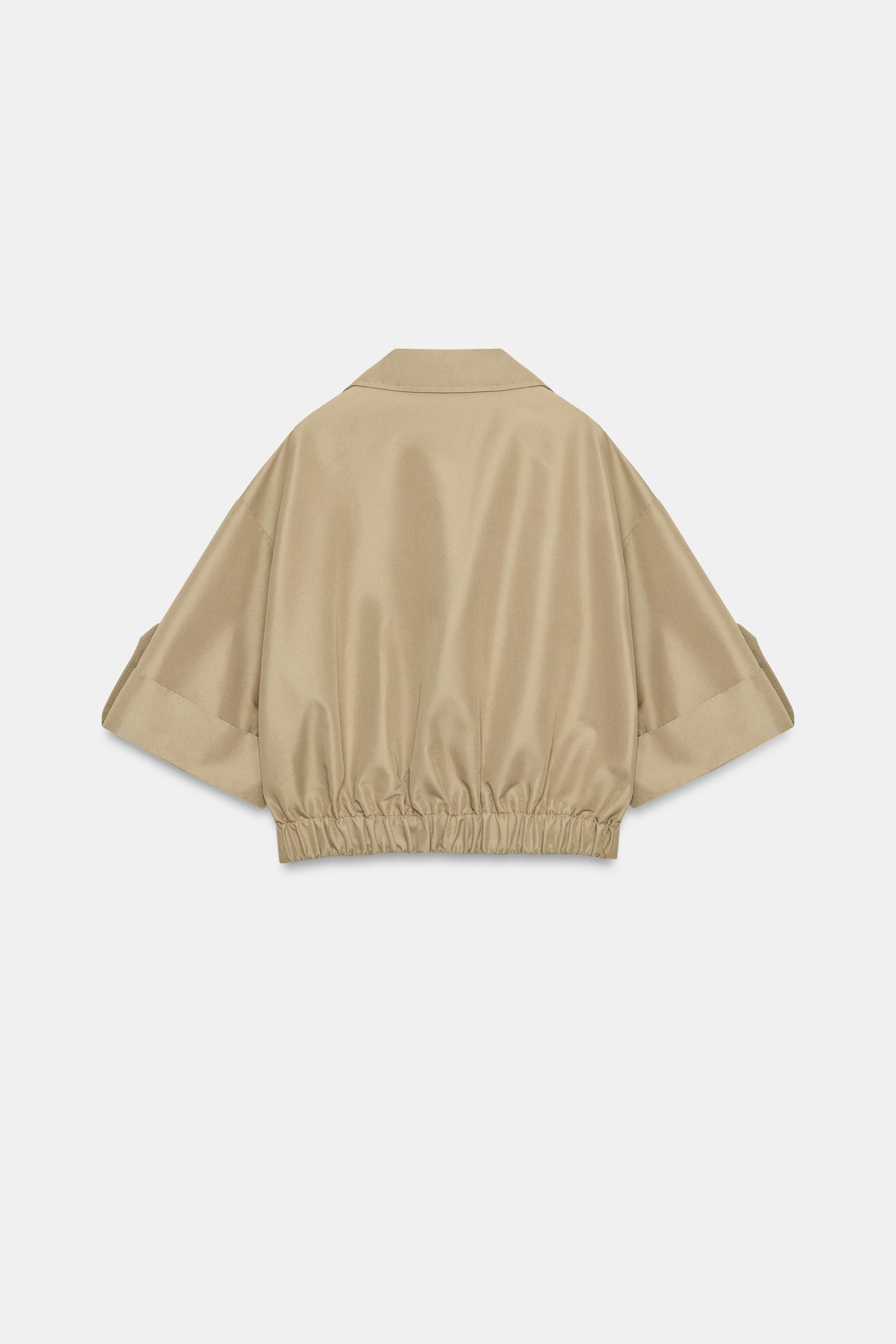 SHORT TRENCH WITH ROLLED SLEEVES